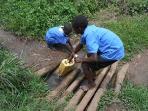 Mawanda village well with kids fetching water