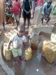 Some kid drawing water on Mawanda well